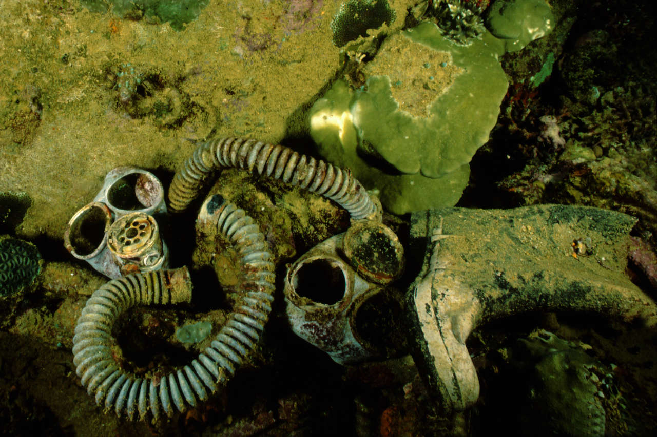 gas masks and rubber boots from world war 2 on the bottom in a wreck in Palau