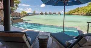 View from the terrace over the private pool and the ocean towards Palau Pacific's overwater bungalows