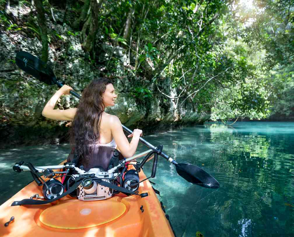 woman in a kayak exploring Nikko Bay